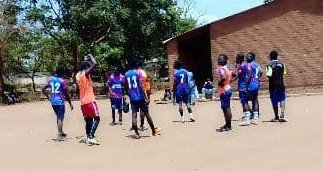 Lion FC players relaxing together after training in Lilongwe